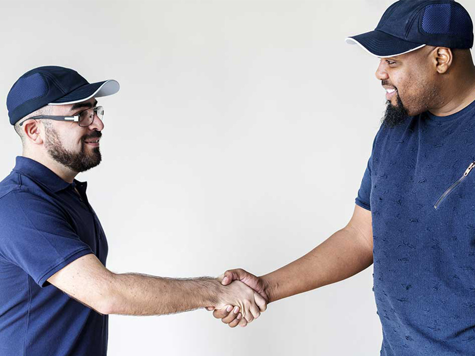 handshake between 2 working men