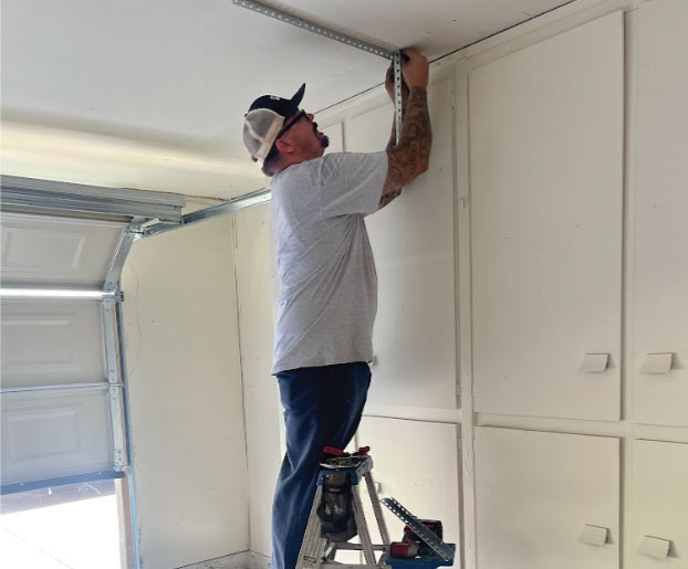 visalia garage door being repair by professional and certified technician